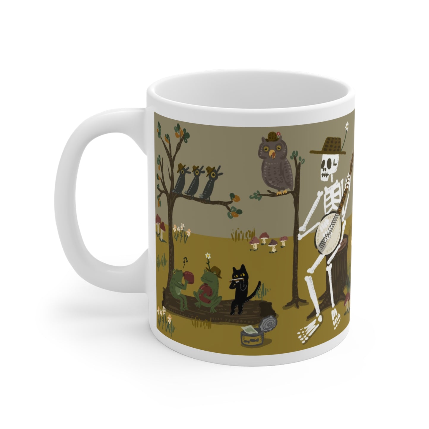 Illustrated ceramic mug with skeleton playing banjo, frogs, cat, and owls in a forest band scene