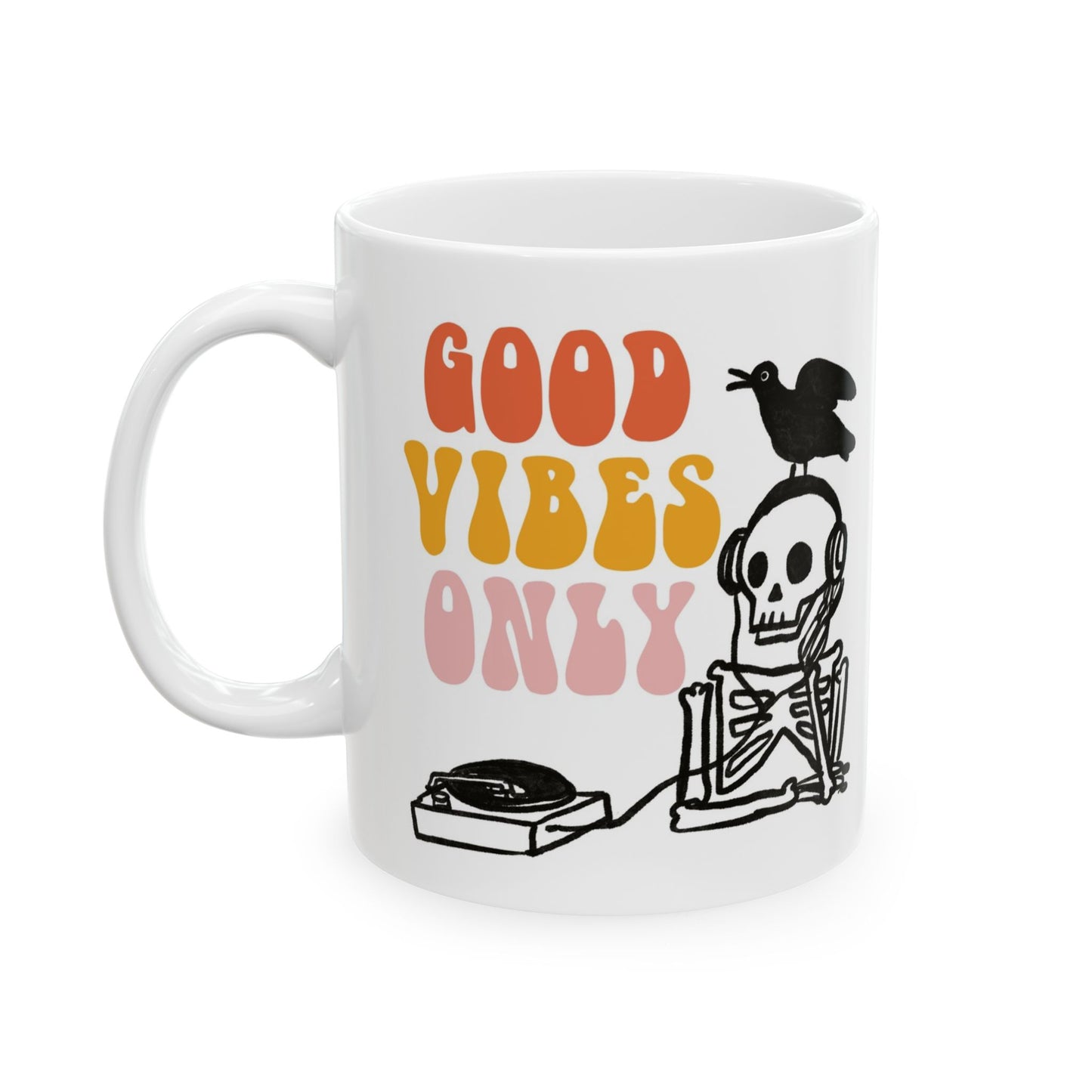 White ceramic mug featuring a skeleton DJ with headphones, a bird on its head, and retro text reading “Good Vibes Only.”