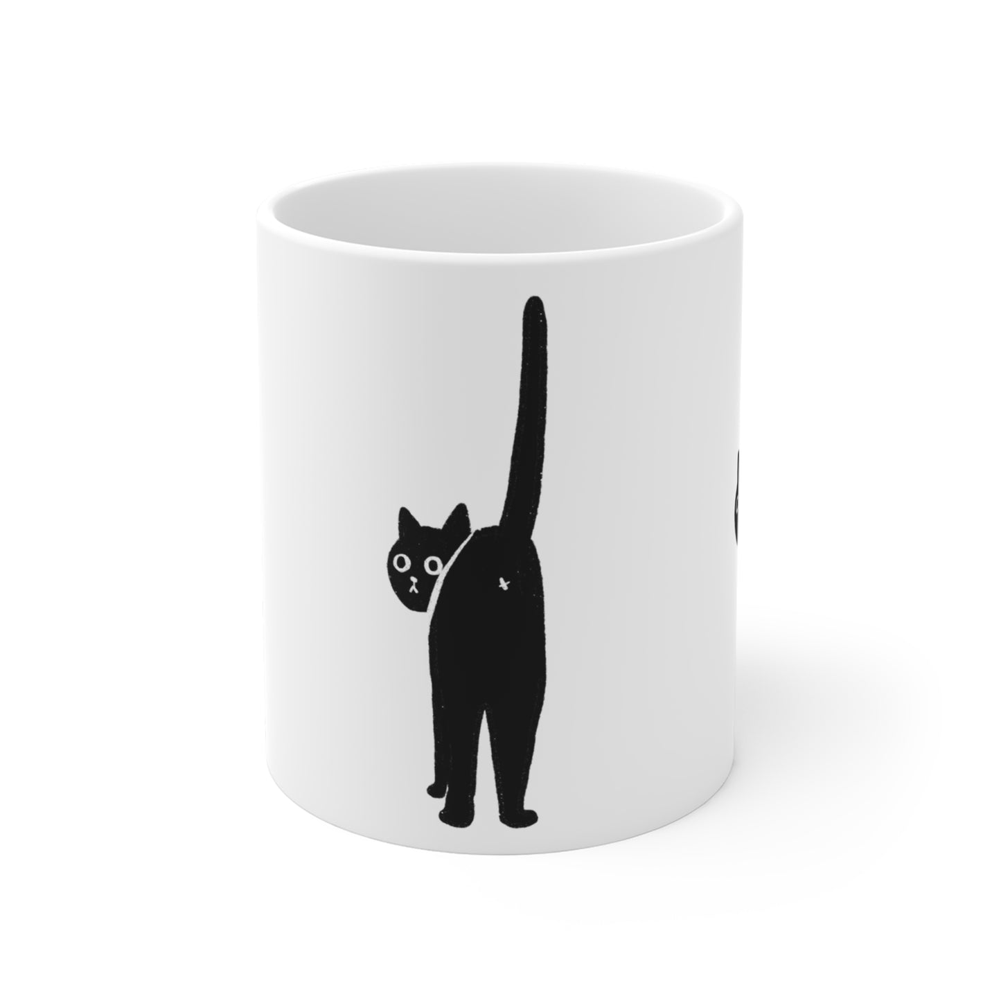 White ceramic mug with a minimalist black cat illustration facing backward with its tail raised.