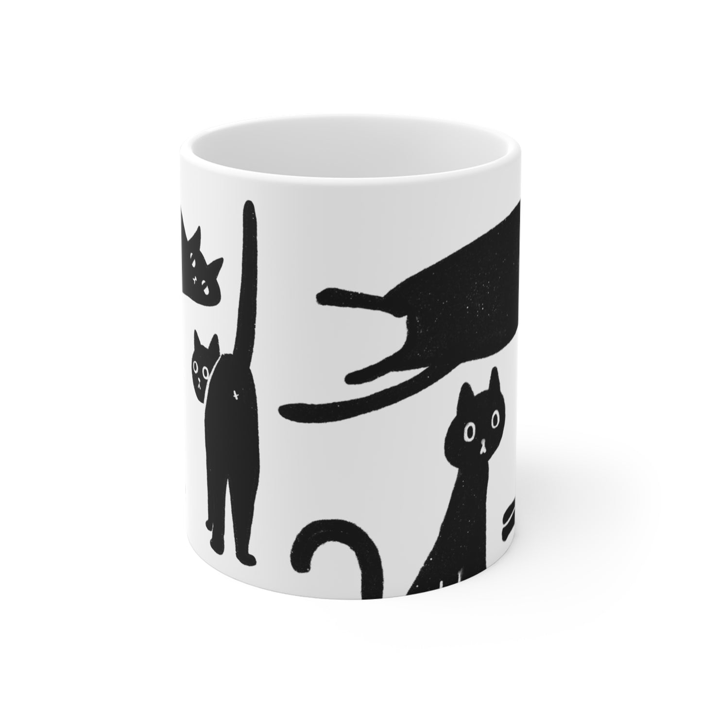 Black and white ceramic mug featuring illustrated black cats in various playful poses.