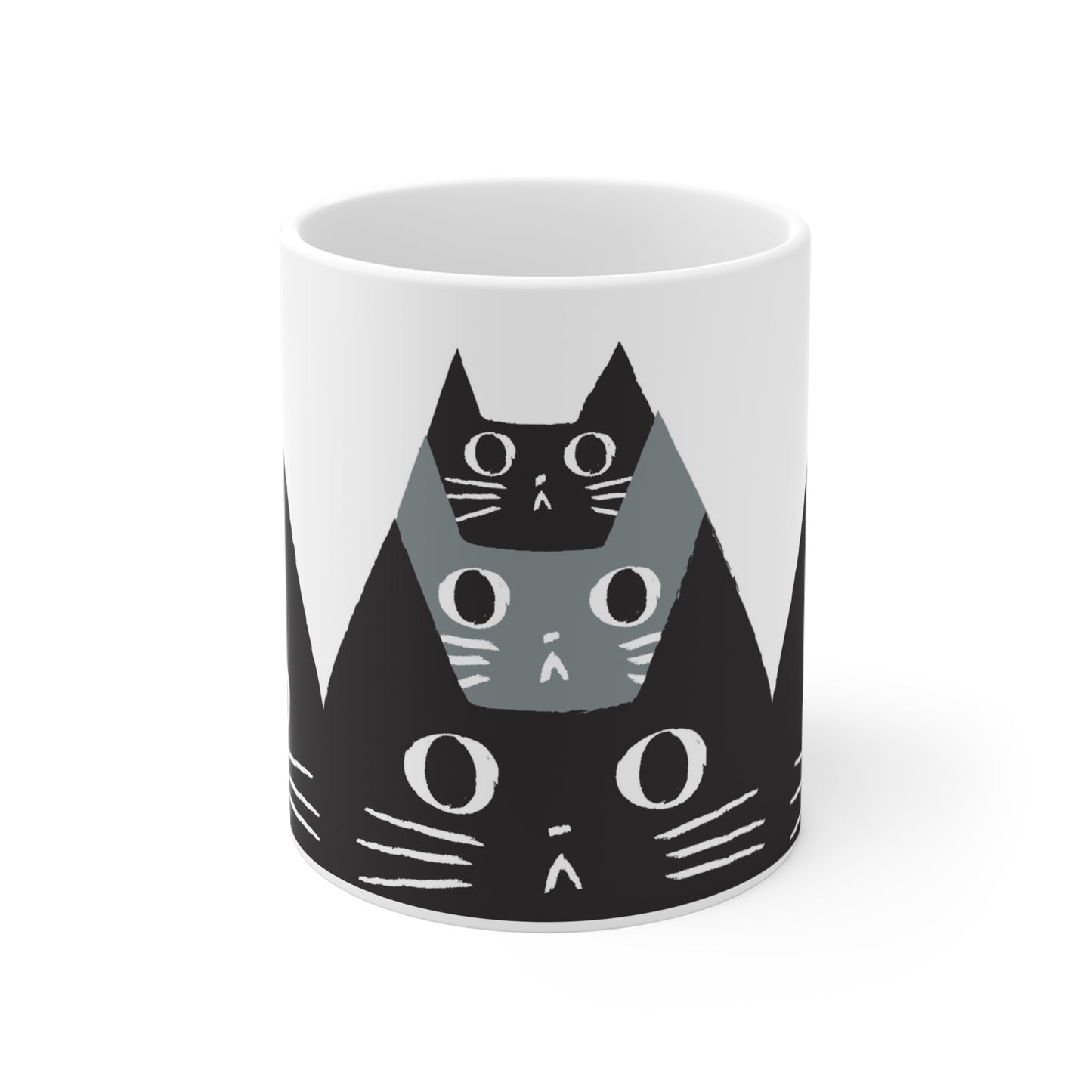Ceramic mug featuring a pattern of black and gray cat faces with wide eyes, modern minimalist cat illustration
