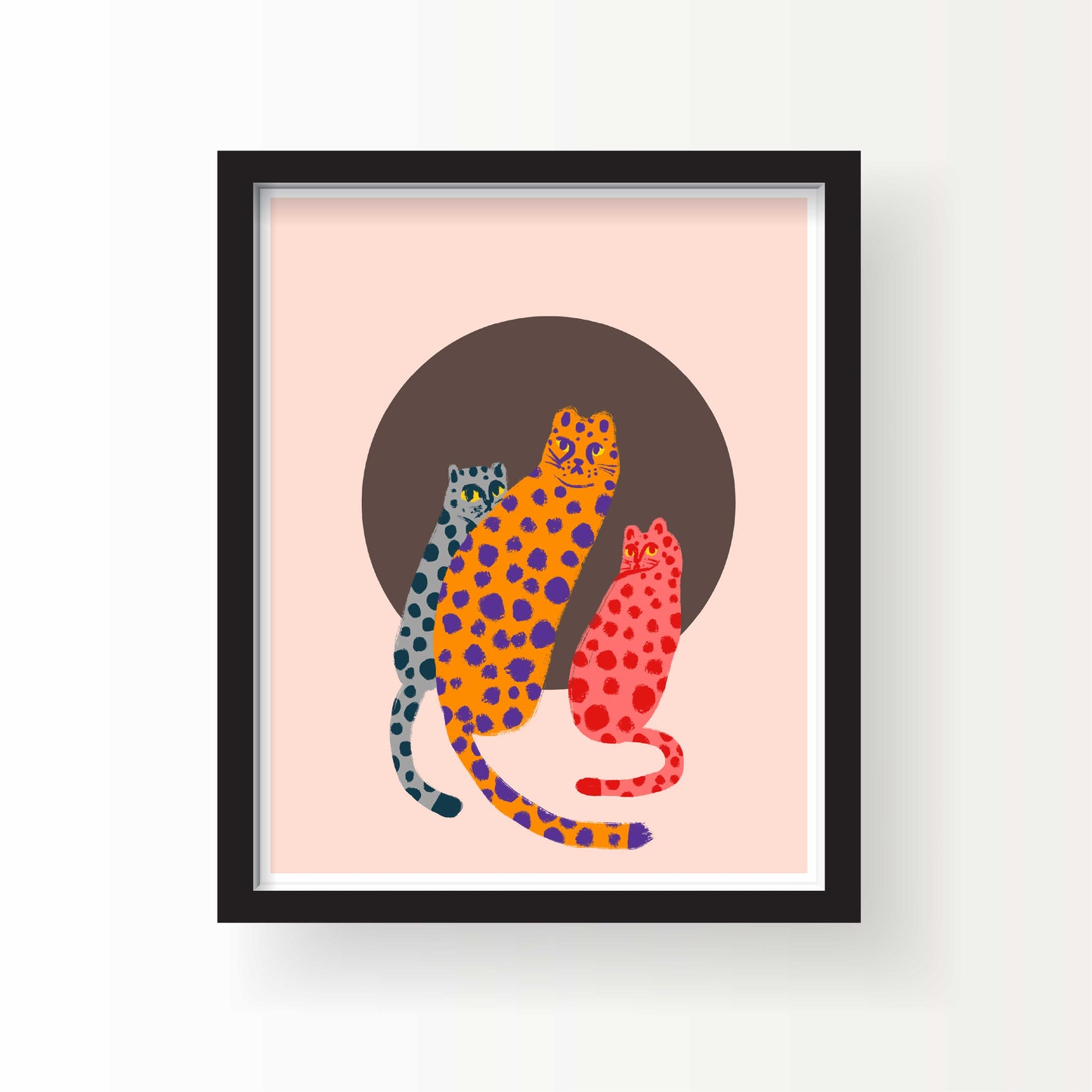 Illustration of three cheetahs in bright blue, orange, and red spotted patterns sitting in front of a brown circle on a pale pink background.