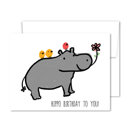 Whimsical hippo birthday greeting card with colorful birds and flower illustration.