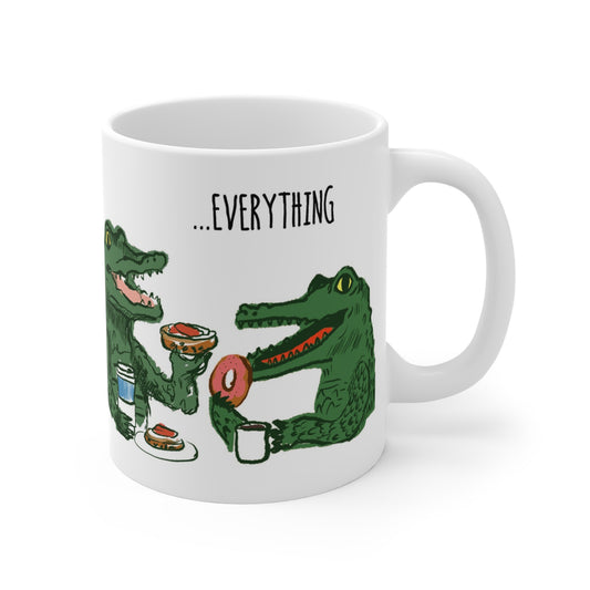 Whimsical alligator illustration on ceramic mug featuring two alligators enjoying breakfast with coffee and donuts.