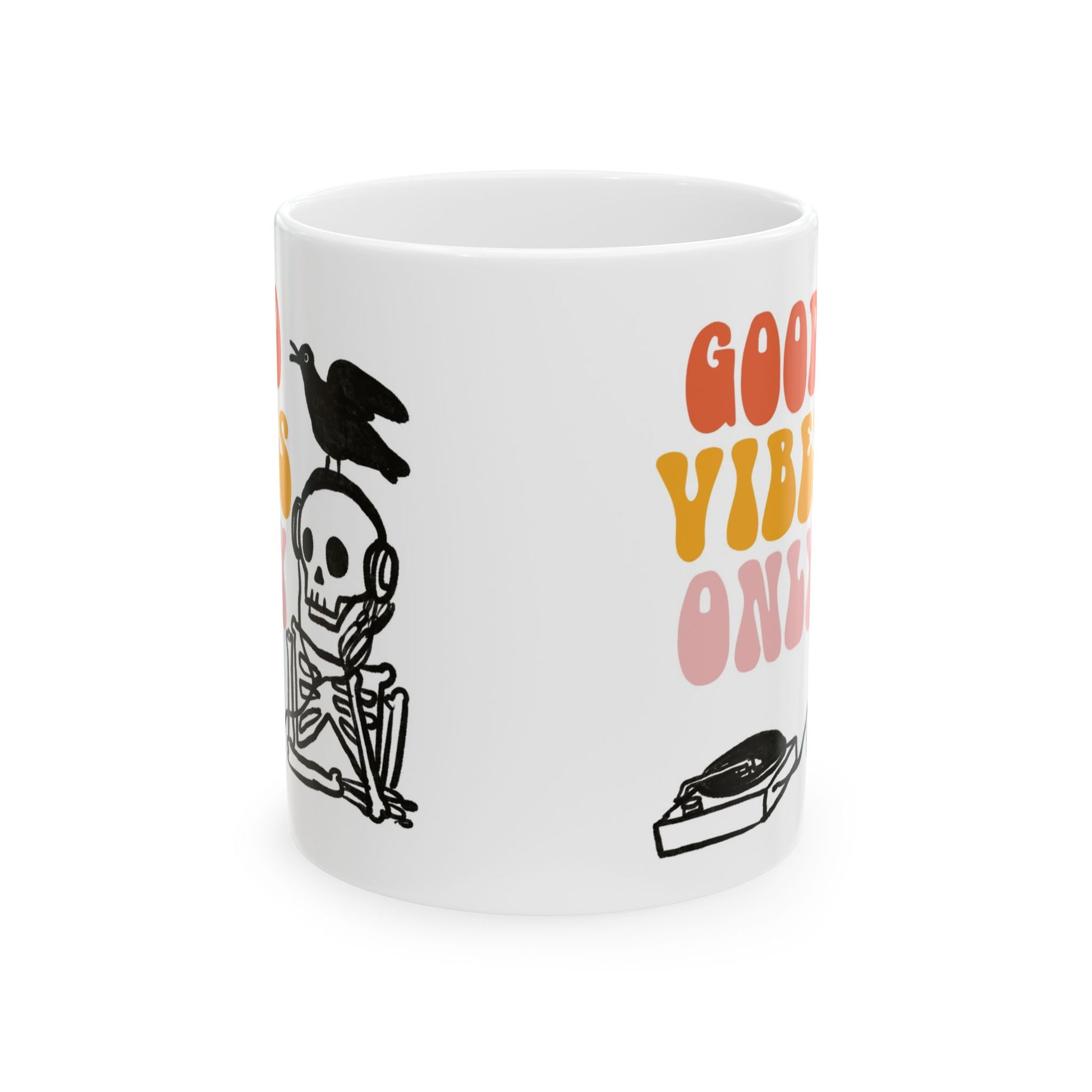 White ceramic mug featuring a skeleton DJ with headphones, a bird on its head, and retro text reading “Good Vibes Only.”