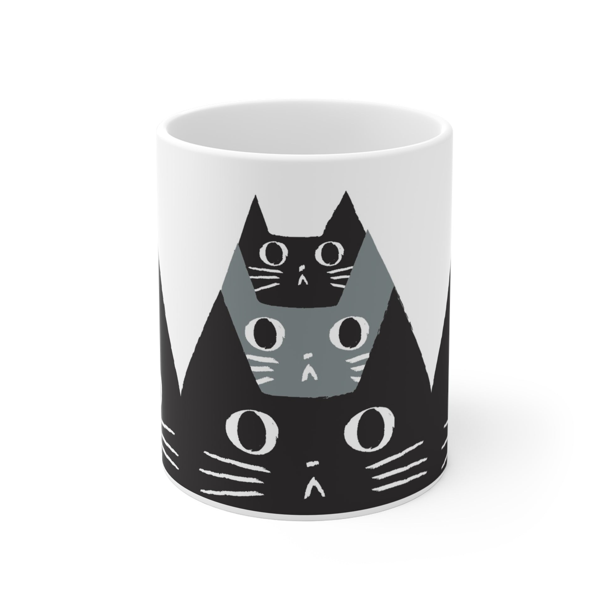 Ceramic mug featuring a pattern of black and gray cat faces with wide eyes, modern minimalist cat illustration