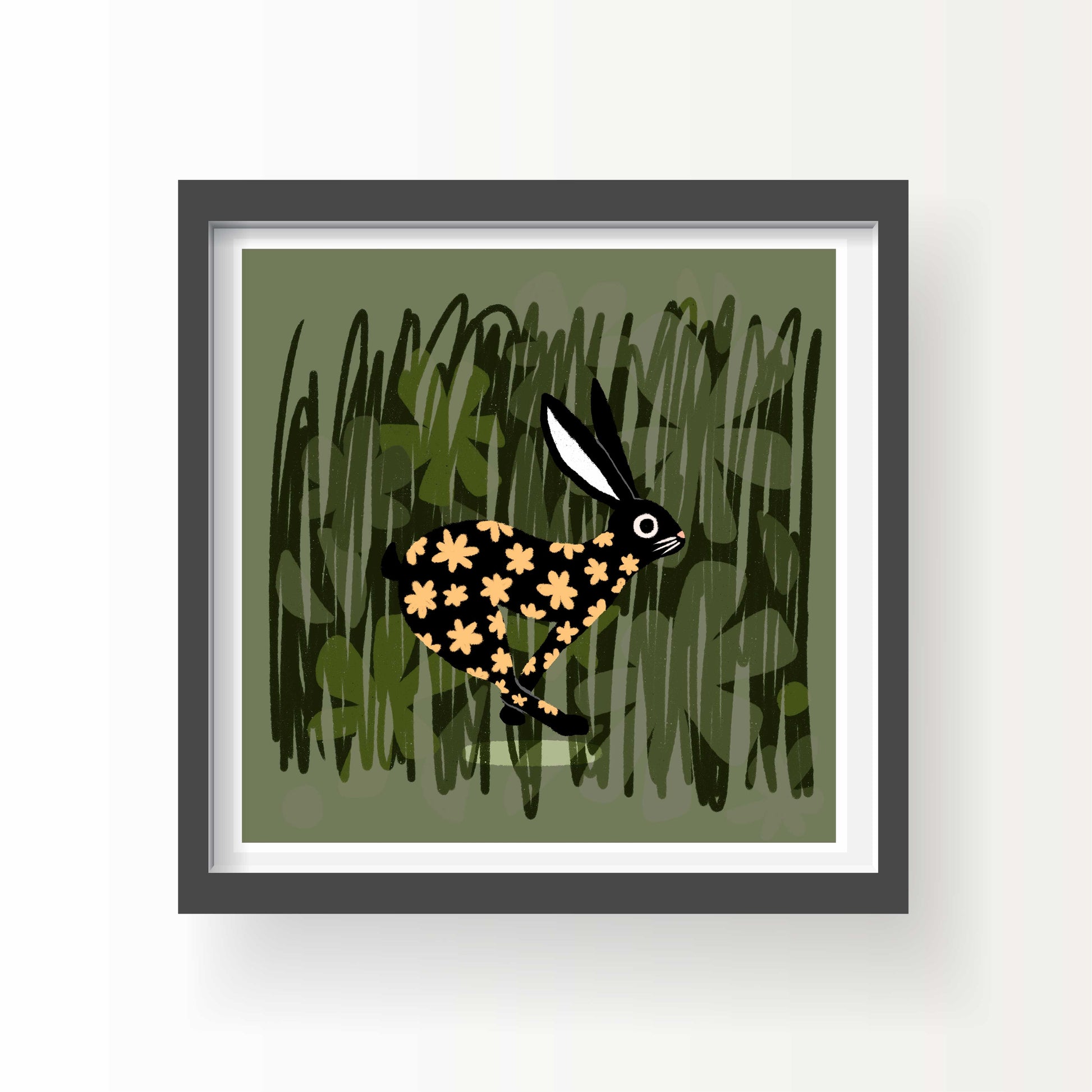 Illustrated black rabbit with golden flower pattern running through green grass, 8x8 art print by Miss Johnny Squirrel