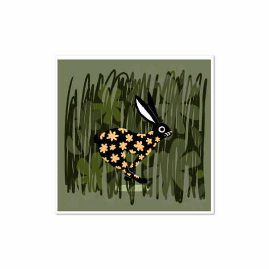 Illustrated black rabbit with golden flower pattern running through green grass, 8x8 art print by Miss Johnny Squirrel