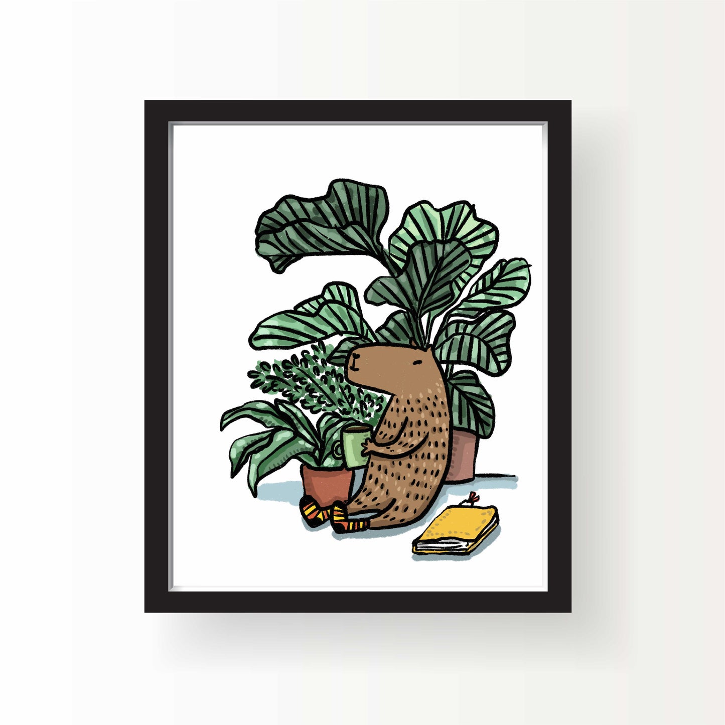 Illustration of a capybara sitting among houseplants holding a coffee mug, with cozy socks and a yellow notebook beside, 8x10 art print by Miss Johnny Squirrel