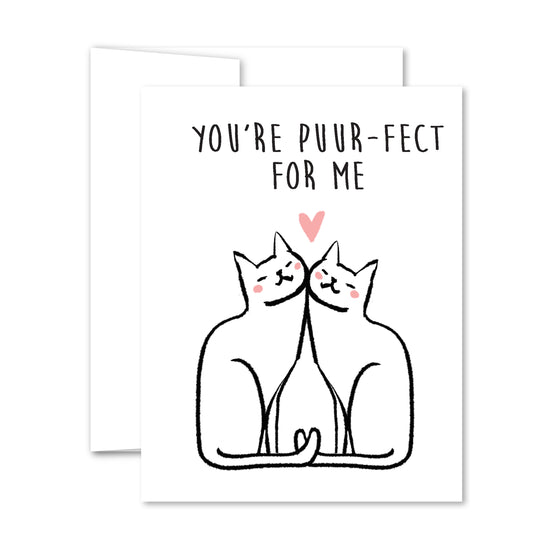 Greeting card with two white cats cuddling, tails intertwined, pink heart above, captioned “You’re puuur-fect for me” in sweet illustration style.
