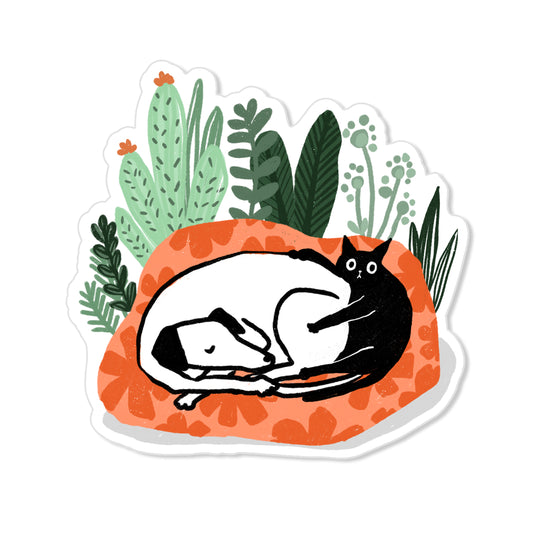 Dog and cat nap sticker with black cat and white dog curled on orange bed with plants, cozy hand-drawn illustration