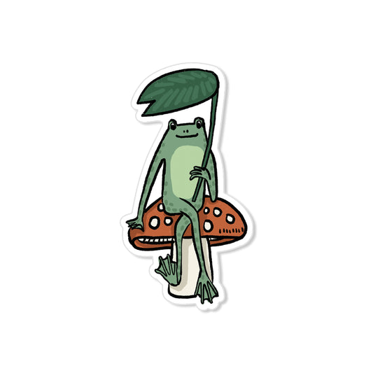 Whimsical frog sticker sitting on red toadstool holding leaf umbrella, hand-drawn illustration
