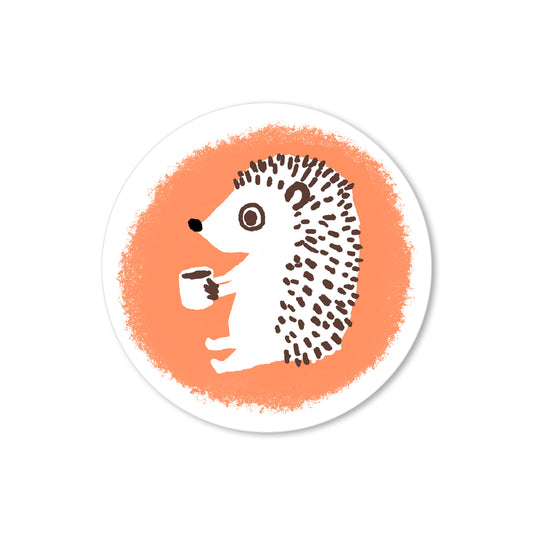 Hand-drawn hedgehog holding a coffee mug against a coral-orange background in a warm, whimsical illustration.