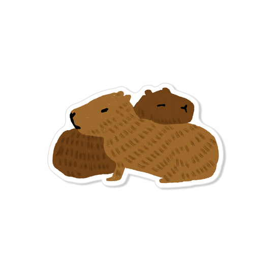 Hugging capybaras sticker with two brown animals resting together, hand-drawn cozy illustration