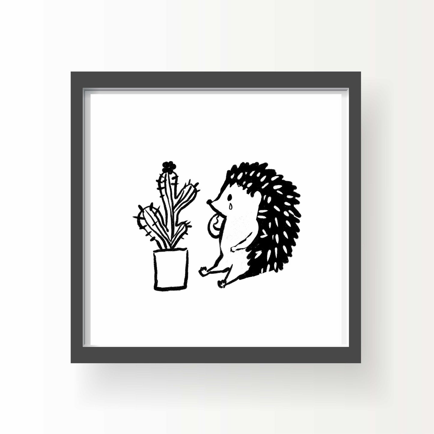 Black and white illustration of a hedgehog sitting in front of a potted cactus, looking emotional, with simple linework and expressive posture.