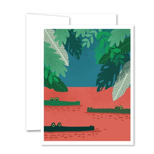 Greeting card with illustrated alligators peeking above the water, surrounded by lush green jungle leaves.