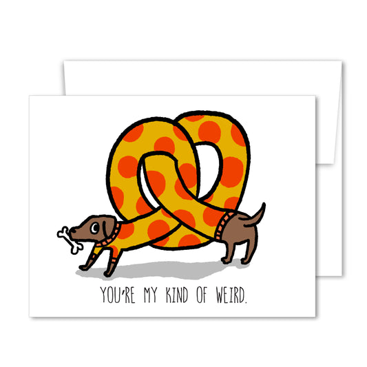 Whimsical friendship card with a hand-drawn dachshund wearing a giant polka-dot pretzel and the message “You’re My Kind of Weird.”