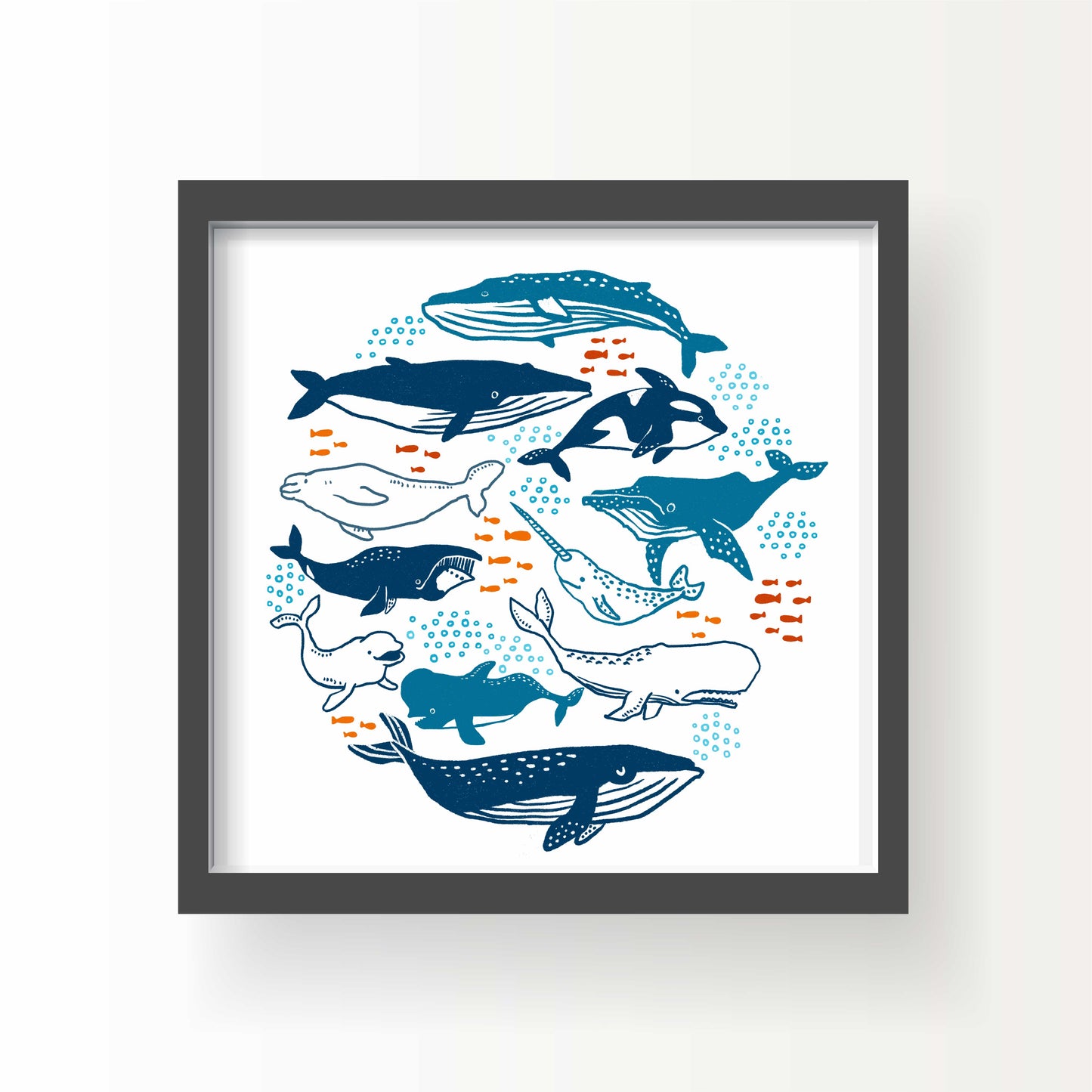 Illustrated print of various whales and ocean creatures in blue tones with orange fish, art by Miss Johnny Squirrel on white background