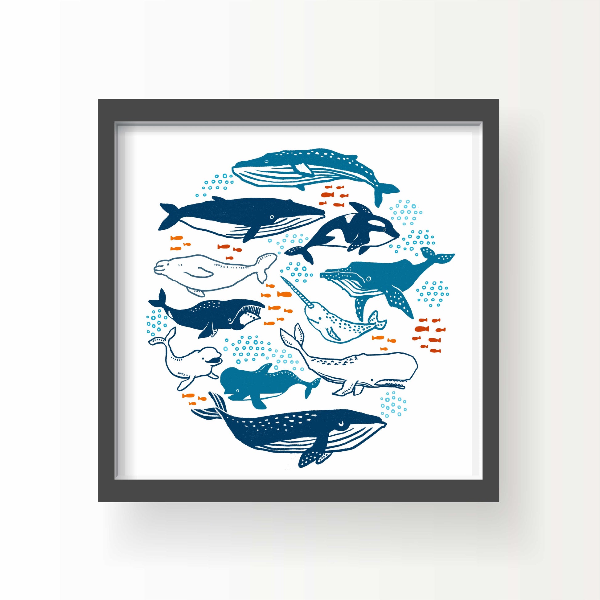 Illustrated print of various whales and ocean creatures in blue tones with orange fish, art by Miss Johnny Squirrel on white background